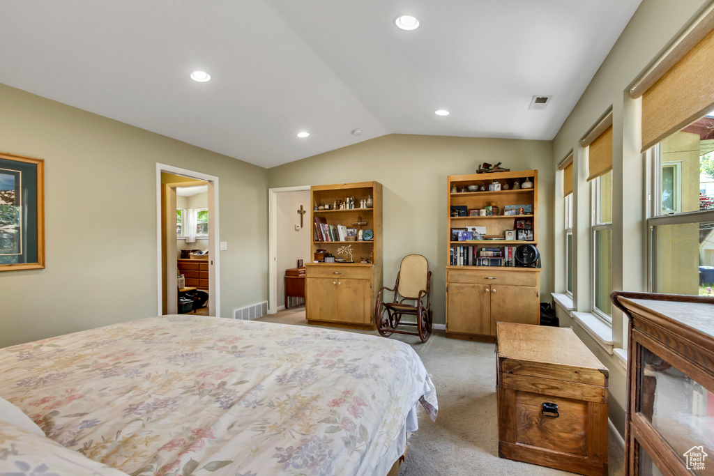 Bedroom featuring vaulted ceiling, light colored carpet, and recessed lighting