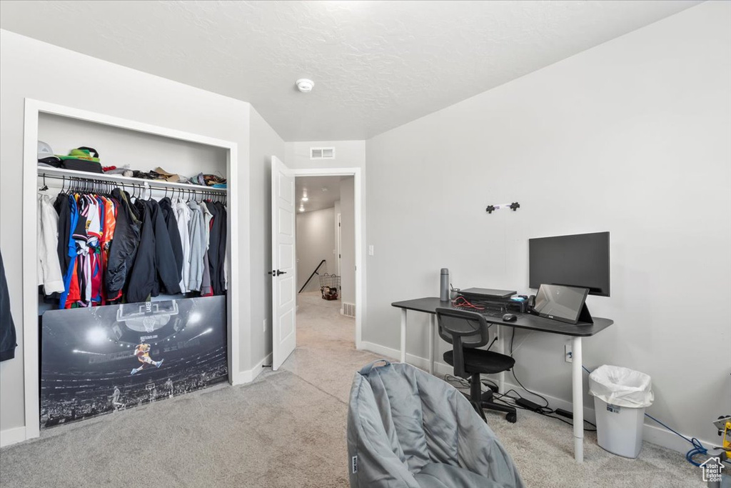 Office space featuring carpet flooring and baseboards