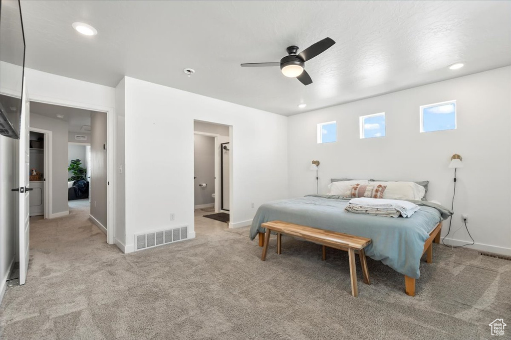 Carpeted bedroom with baseboards, recessed lighting, ceiling fan, and ensuite bath