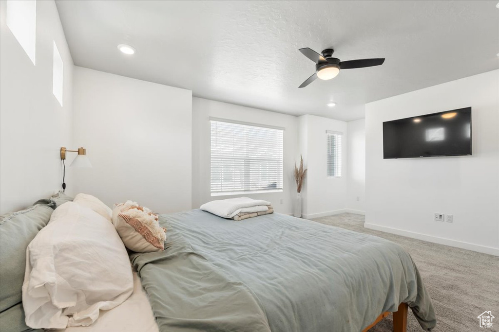 Bedroom featuring carpet, baseboards, a ceiling fan, and recessed lighting