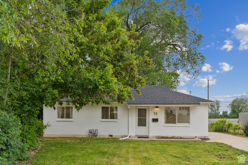 View of front of home featuring a shingled roof