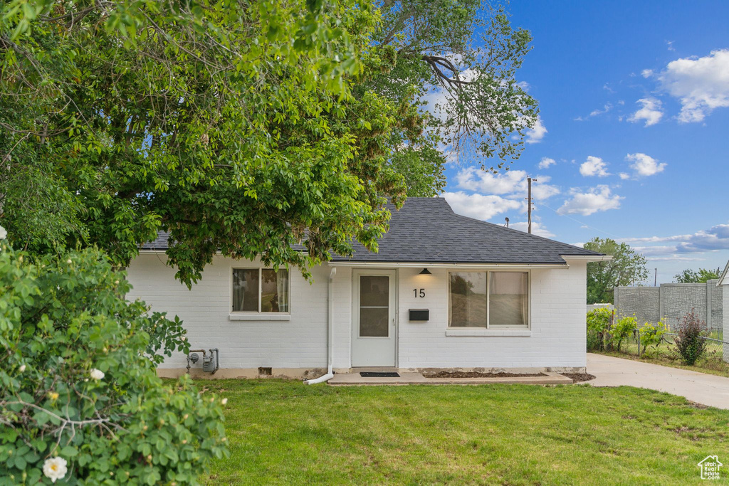 View of front of home with roof with shingles