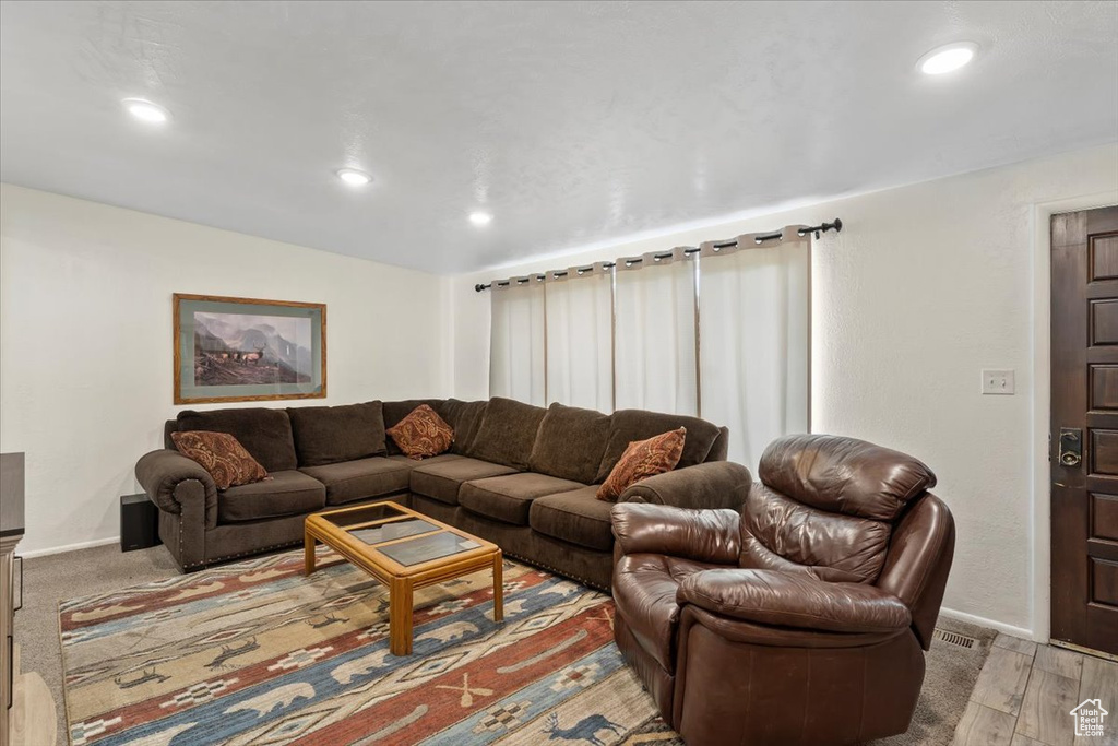 Living area featuring recessed lighting and baseboards