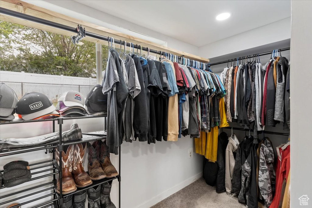 Walk in closet featuring carpet floors