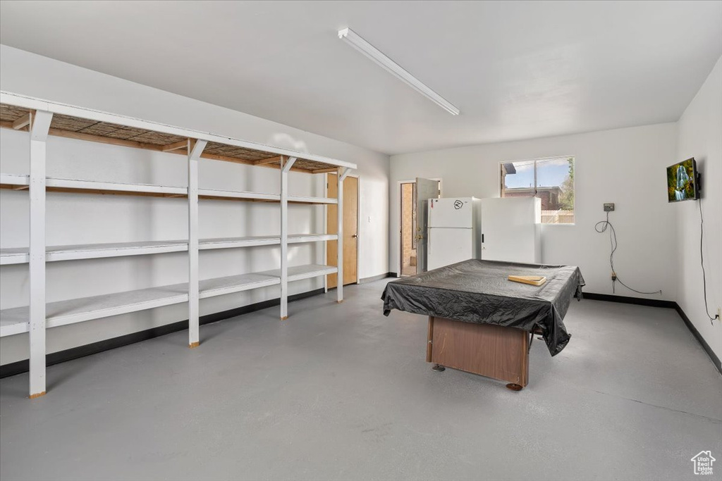 Rec room with billiards, finished concrete floors, and baseboards