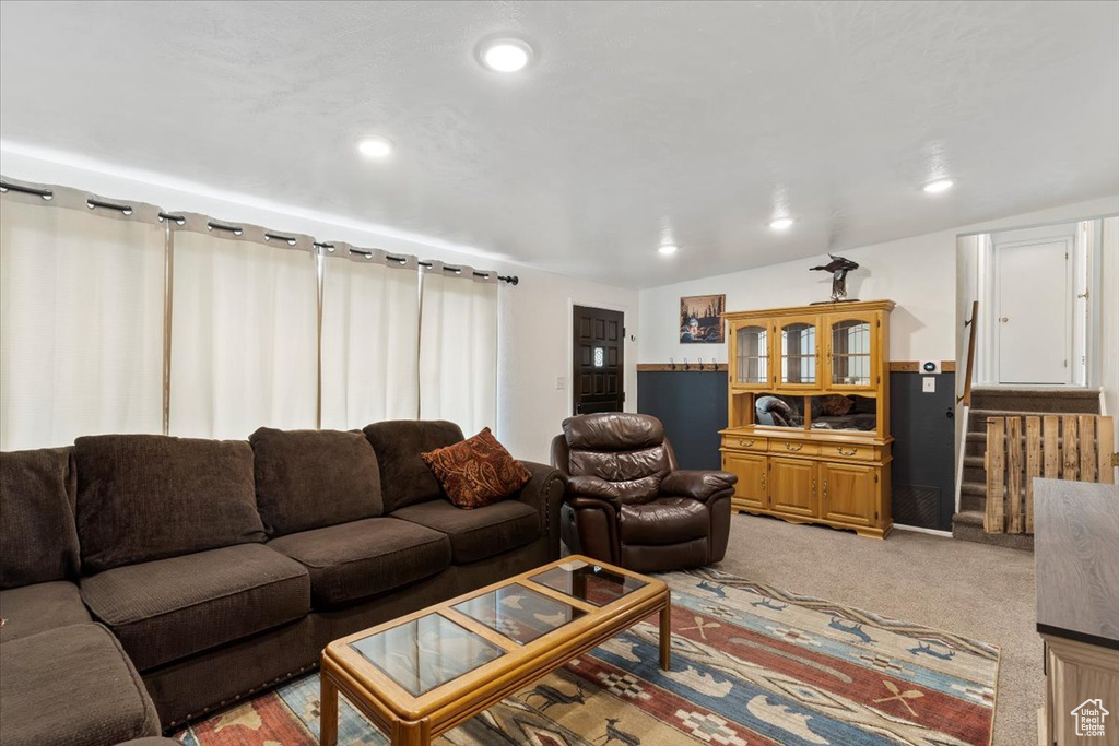 Living room with light carpet and recessed lighting