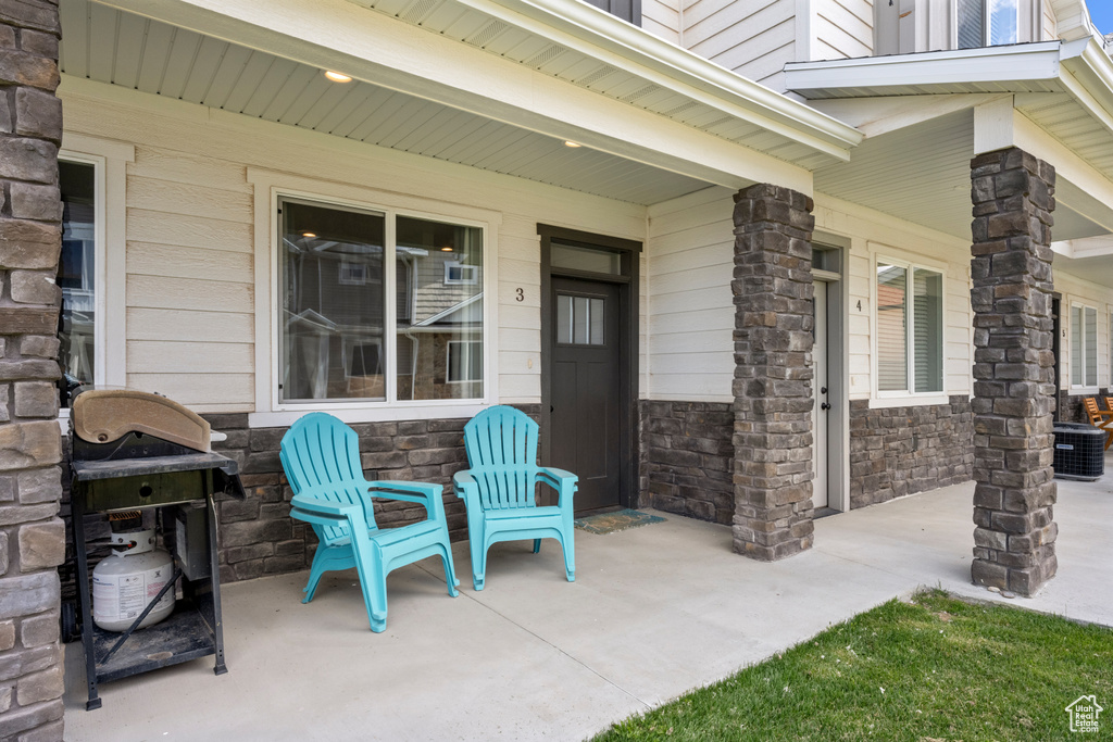 Porch featuring a grill