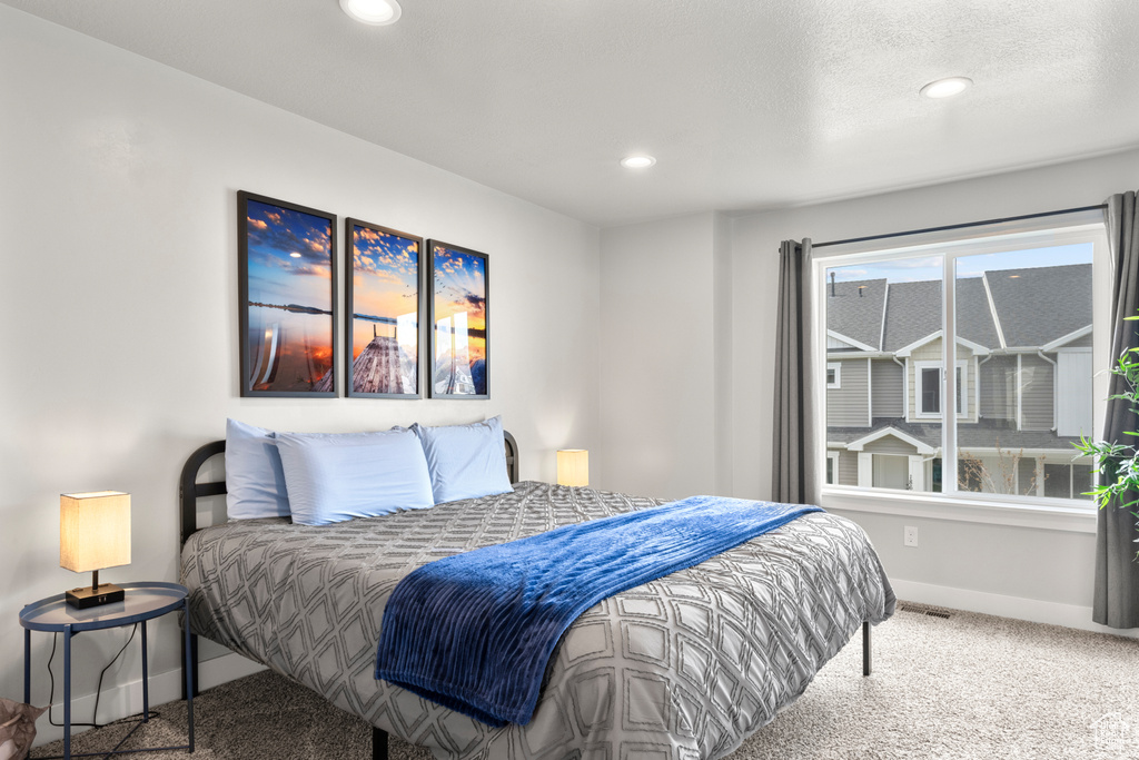Bedroom with baseboards, carpet, and recessed lighting