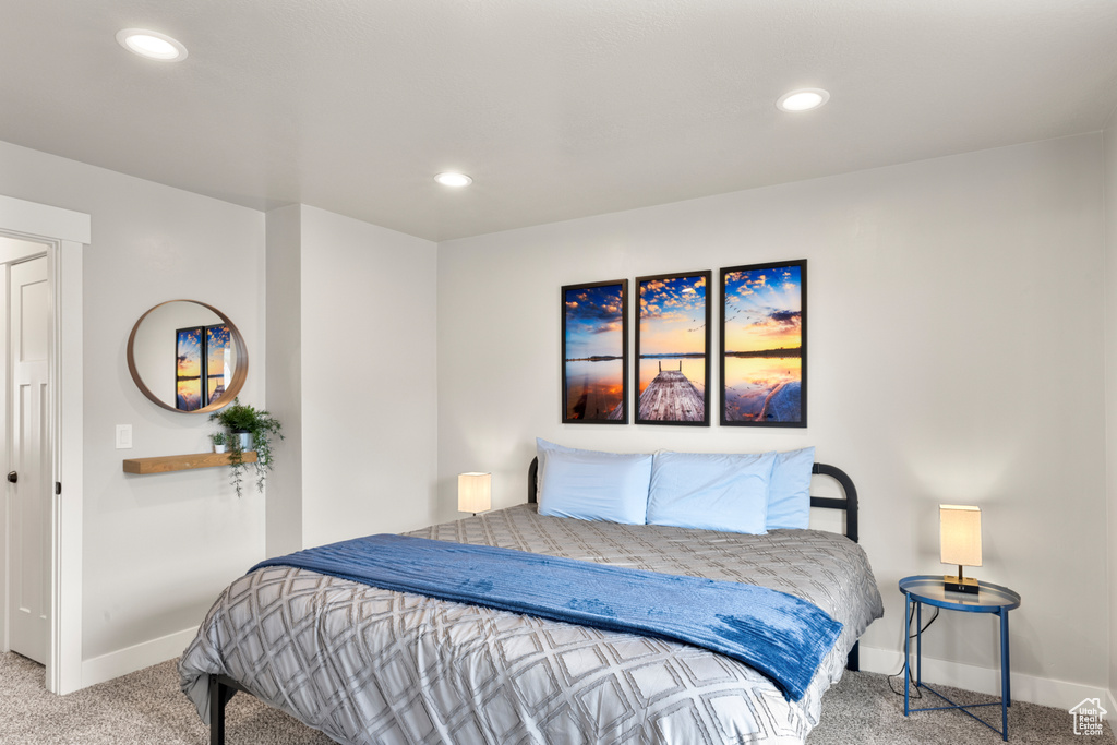 Bedroom with carpet flooring, baseboards, and recessed lighting