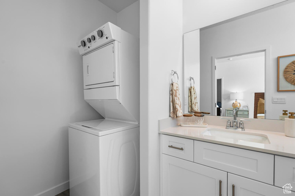 Laundry room with estacked washer and dryer