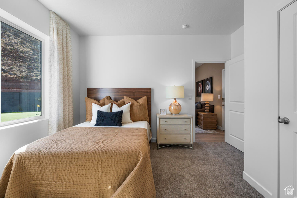 Bedroom with carpet and baseboards