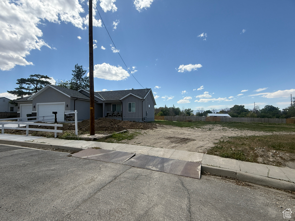 Ranch-style home with driveway and an attached garage
