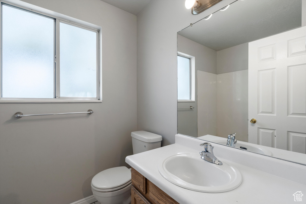 Bathroom featuring toilet and vanity