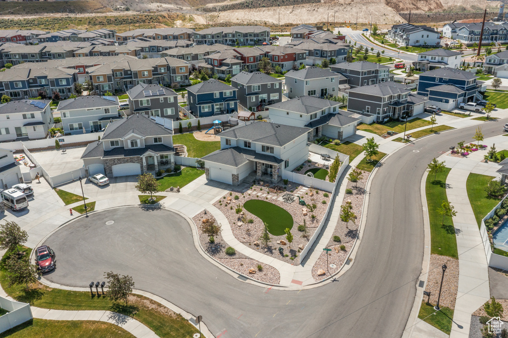 Aerial view of residential area featuring a mountainous background