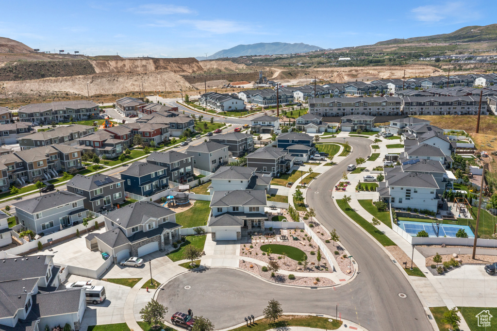 Aerial overview of property\'s location featuring mountains and nearby suburban area