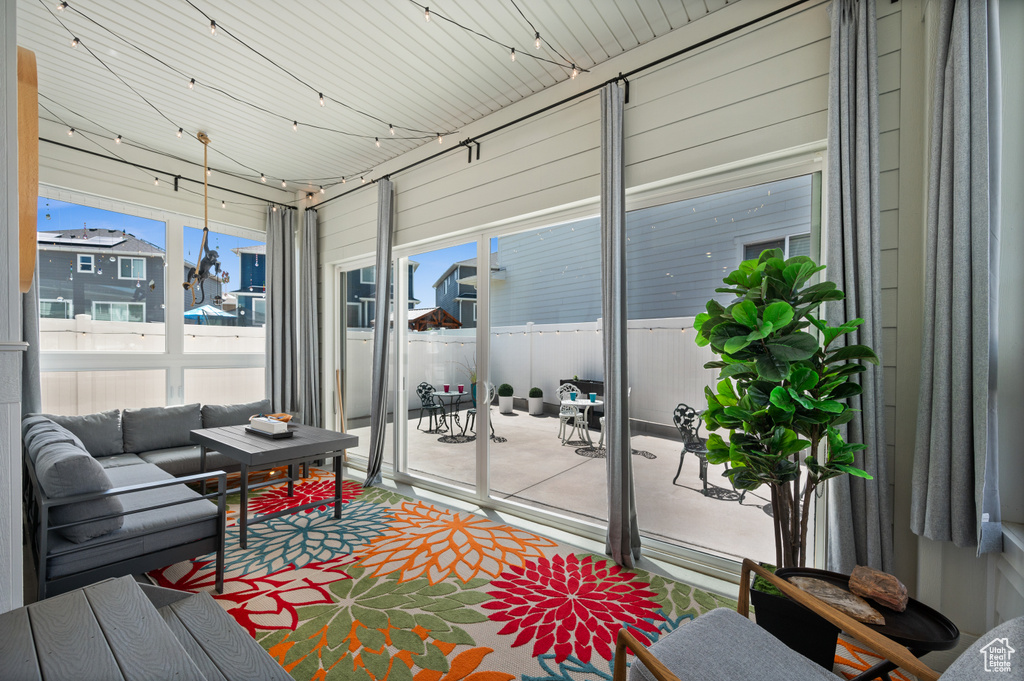 Sunroom / solarium featuring outdoor lounge area