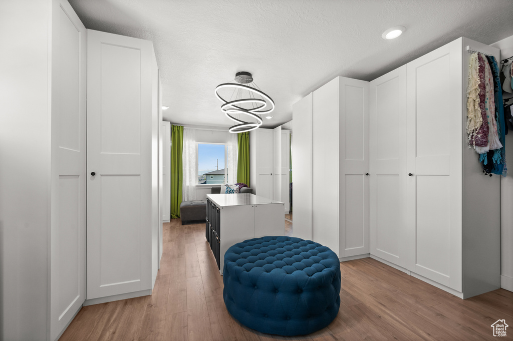 Walk in closet featuring light wood-type flooring