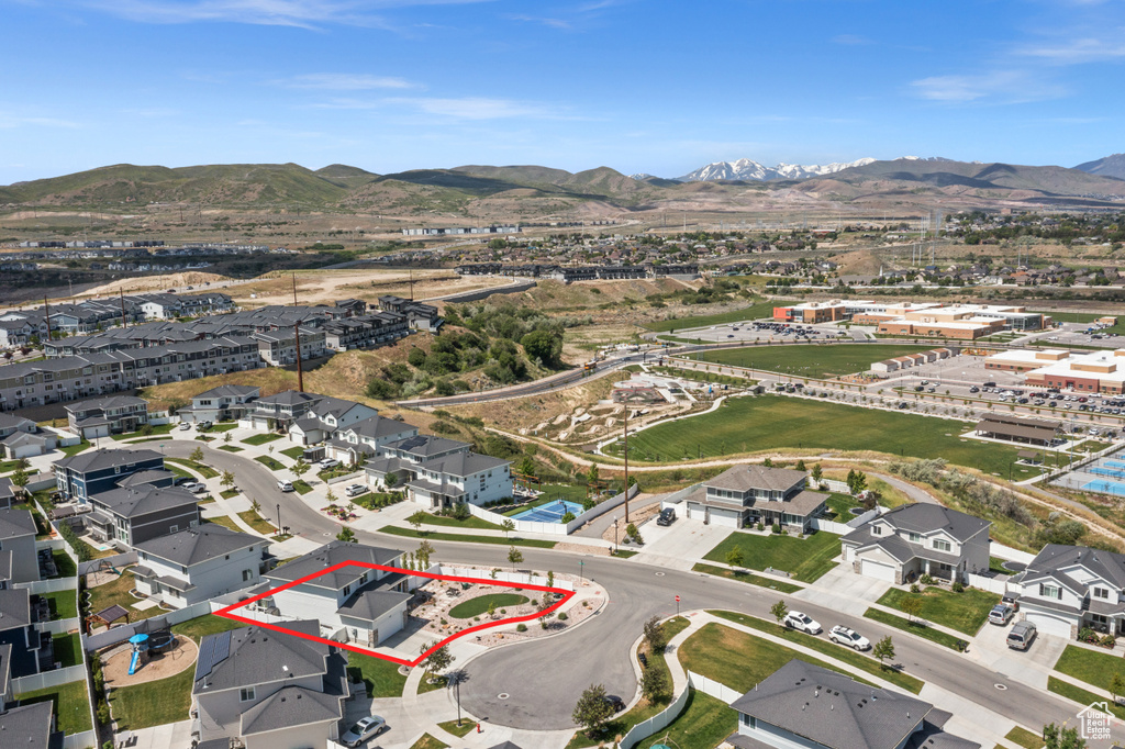 View of property location with mountains, property boundaries highlighted, and nearby suburban area