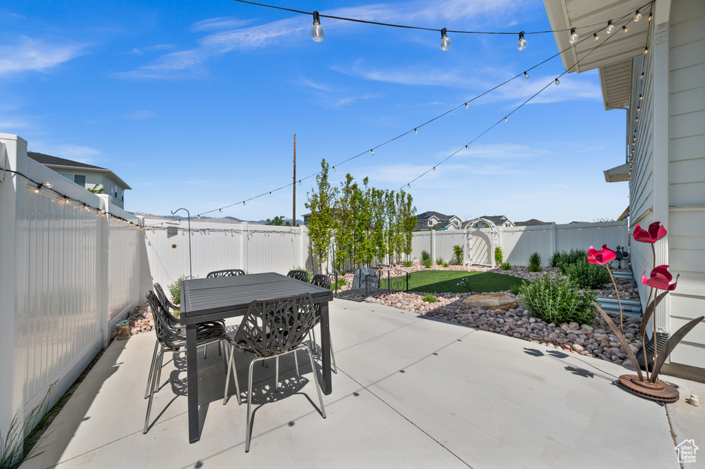 Fenced backyard with a patio and outdoor dining area