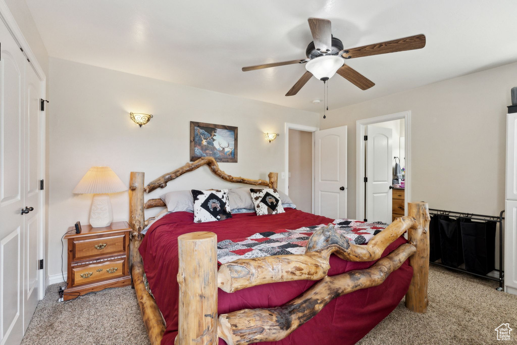 Bedroom with carpet flooring, ceiling fan, and a closet