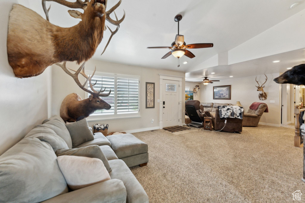Living area featuring lofted ceiling, a ceiling fan, baseboards, carpet flooring, and recessed lighting