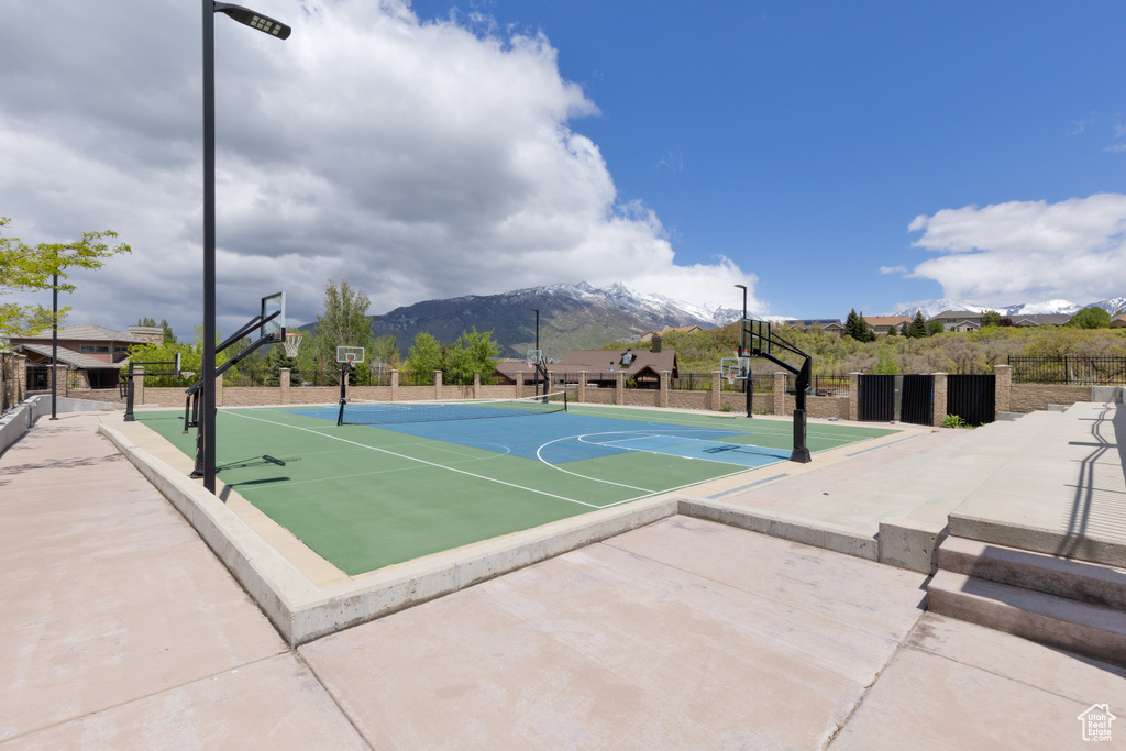 View of basketball court with community basketball court and a mountain view