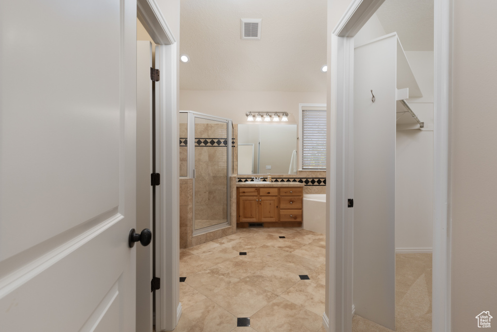 Full bathroom with a stall shower and vanity
