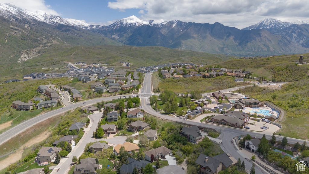 Aerial view of property\\\\\\\'s location featuring nearby suburban area and a mountainous background