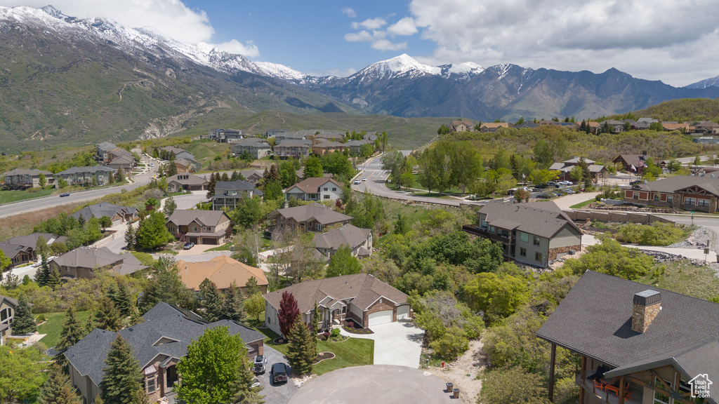 Aerial perspective of suburban area featuring a mountainous background