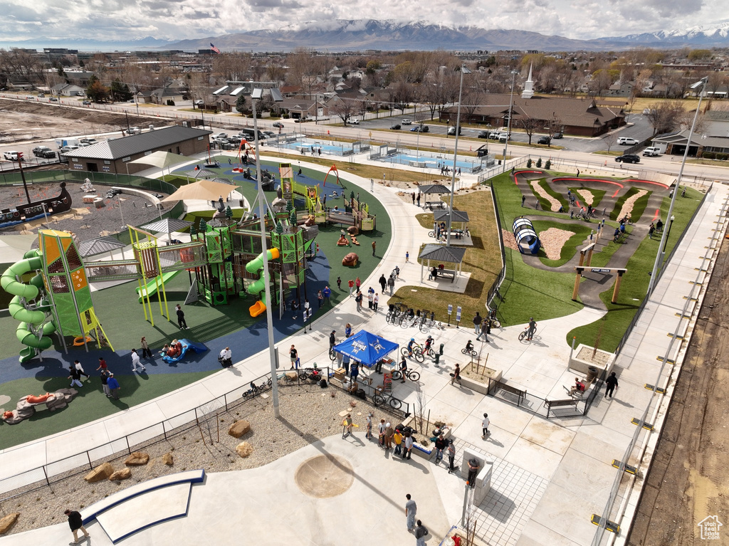 Drone / aerial view of a community park and a mountain backdrop
