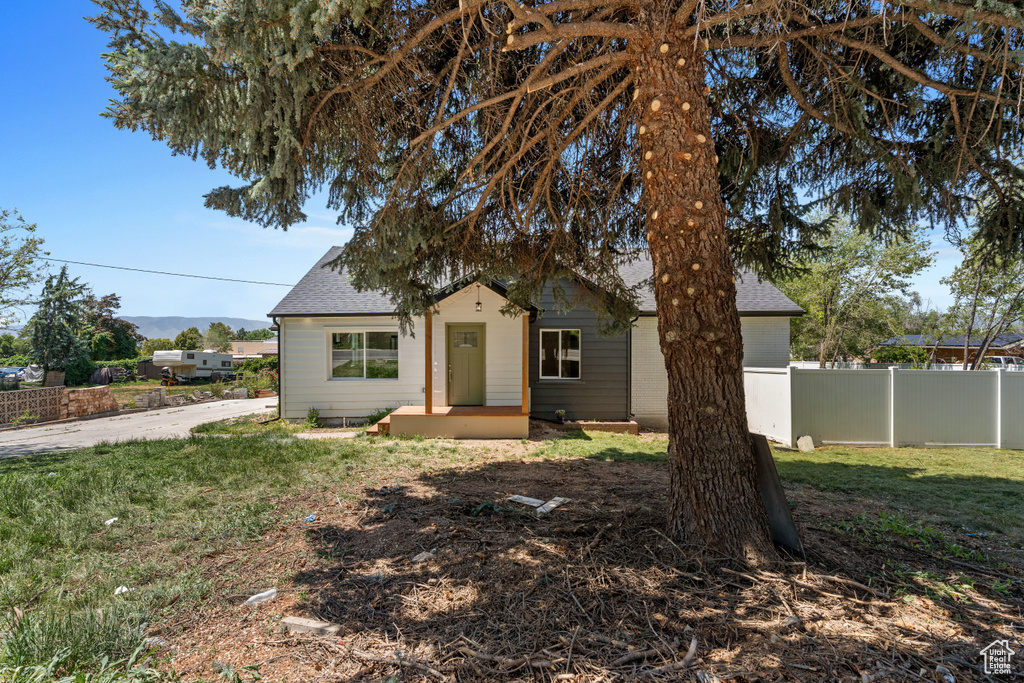 Bungalow-style home featuring a shingled roof