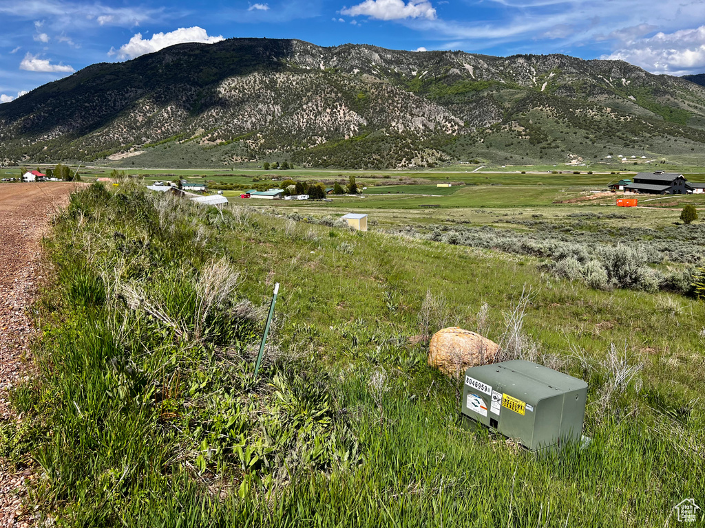 View of mountain background featuring rural landscape