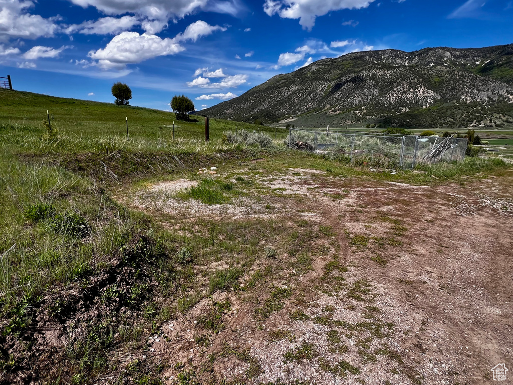 View of mountain backdrop featuring rural landscape