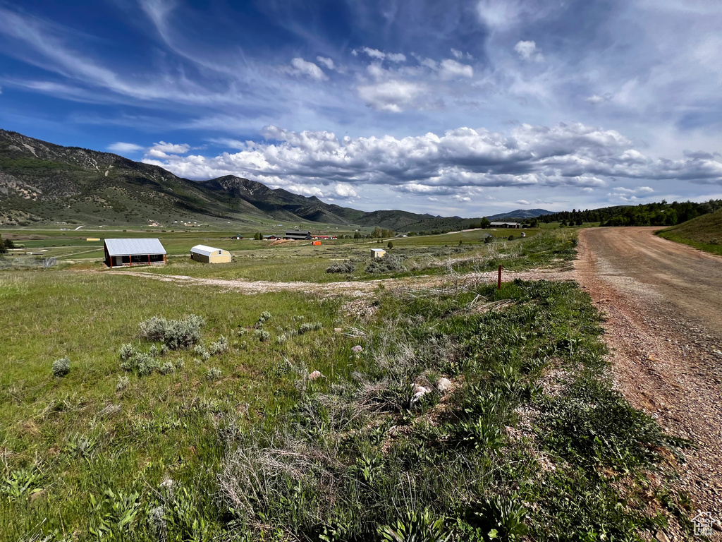 View of mountain backdrop with rural landscape