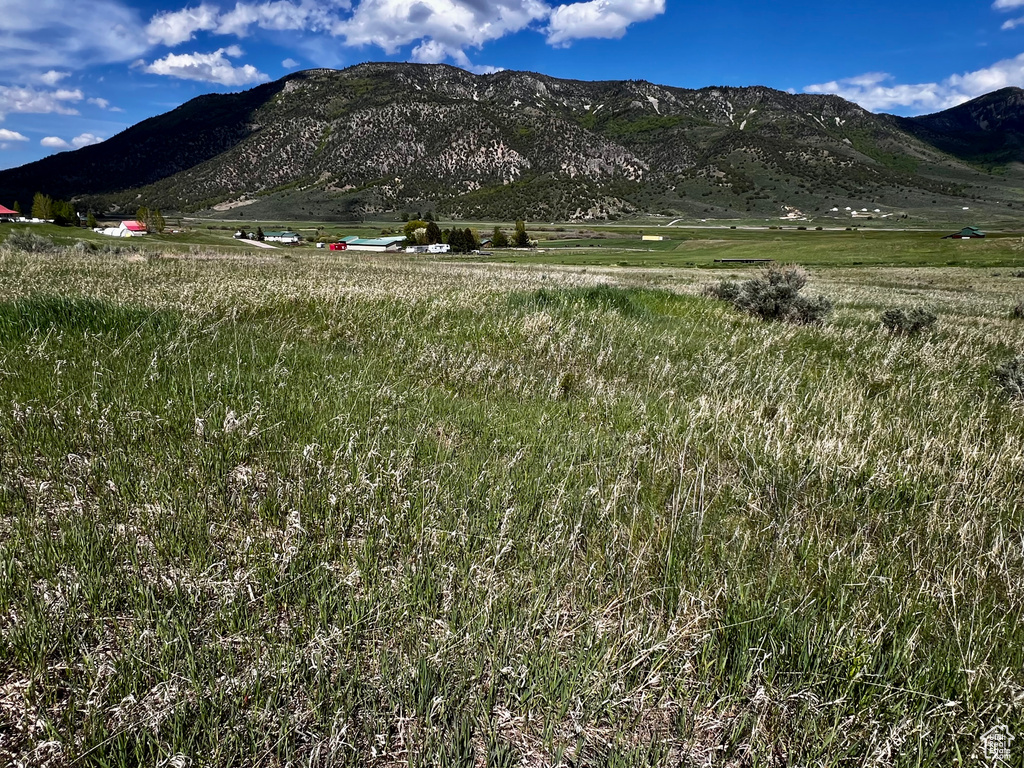 View of mountain backdrop with rural landscape