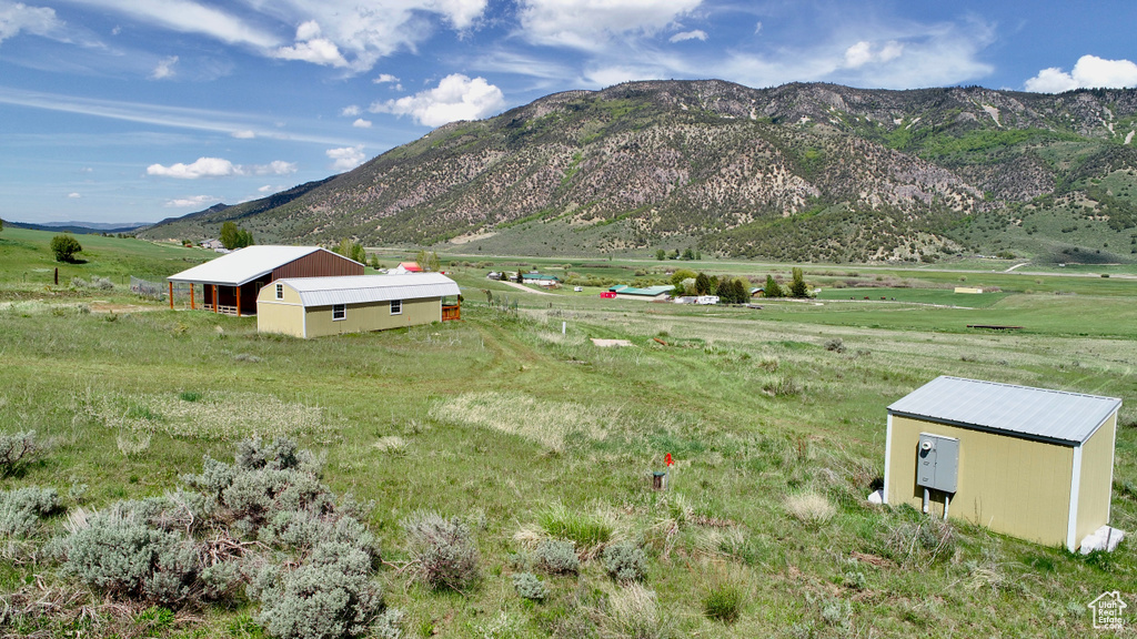 View of mountain backdrop with rural landscape