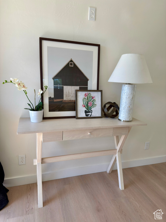 Detailed view of wood finished floors and baseboards