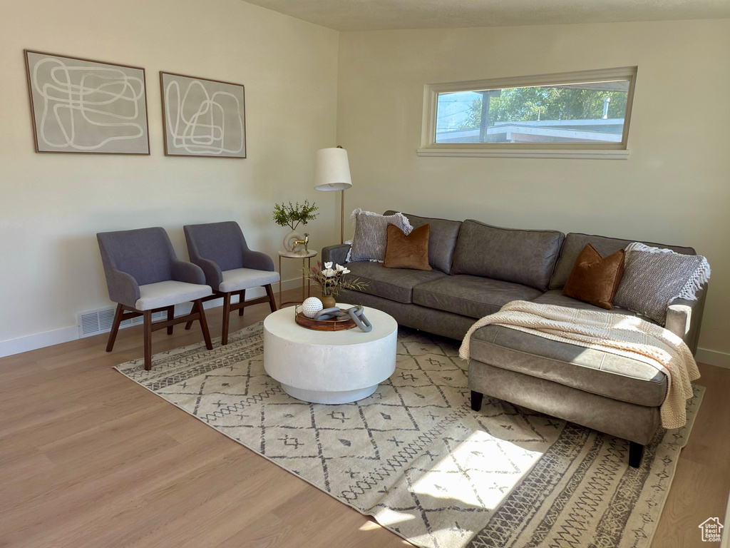 Living area featuring wood finished floors and baseboards