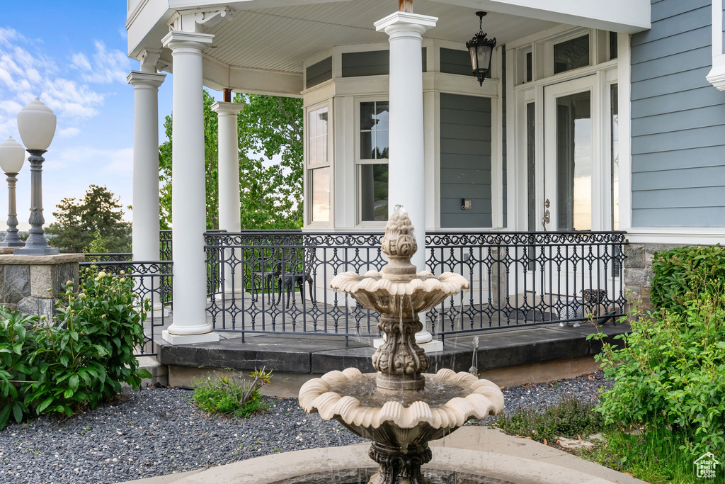 Doorway to property featuring a porch