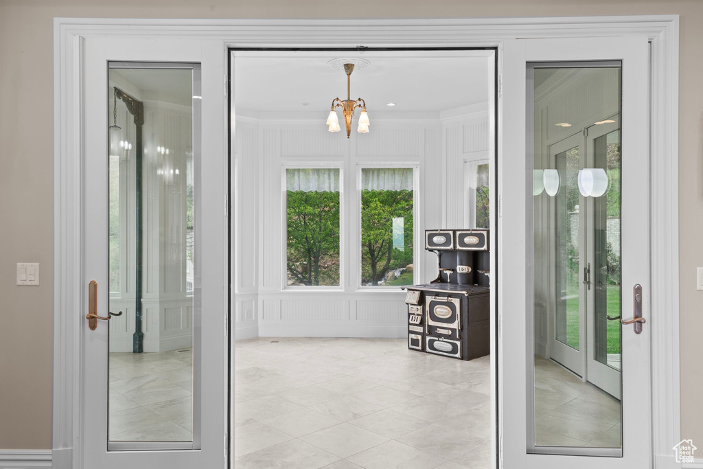 Property entrance featuring french doors