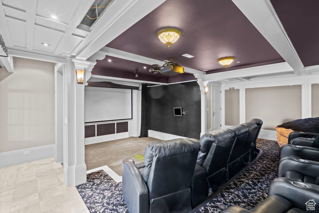 Home theater featuring ornate columns, recessed lighting, coffered ceiling, and beamed ceiling