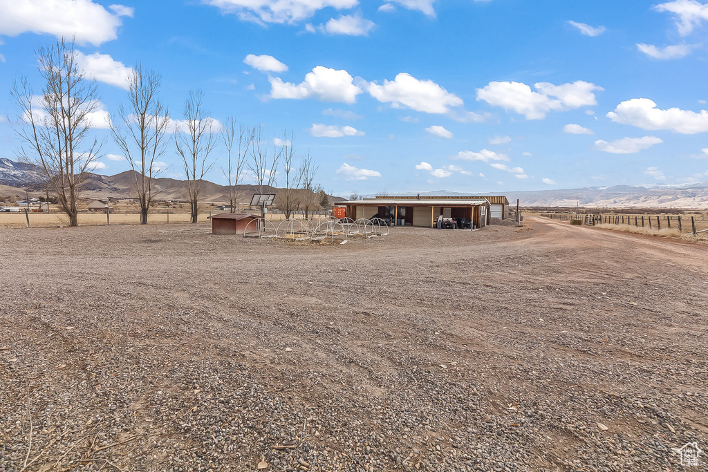 Rear view of house featuring a mountain view and a view of rural / pastoral area
