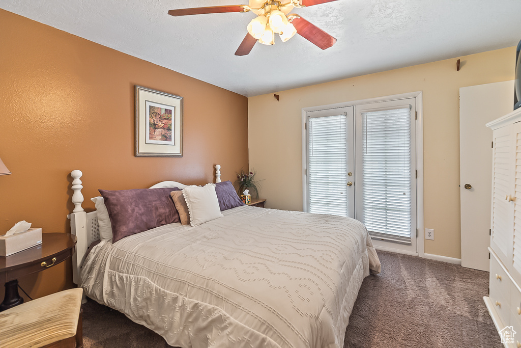 Bedroom with carpet, multiple windows, access to outside, and ceiling fan