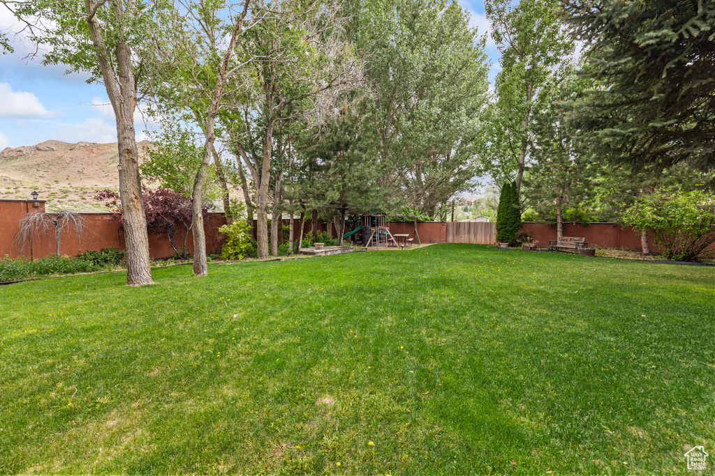 View of yard featuring a playground