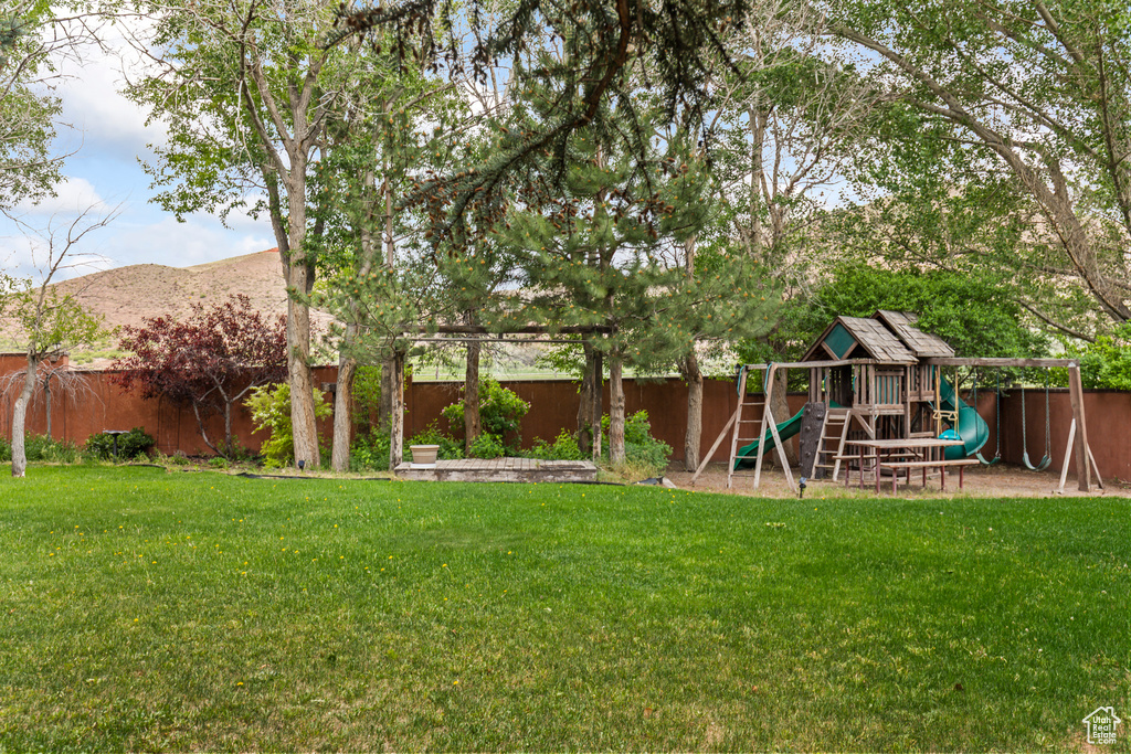 View of yard featuring a playground