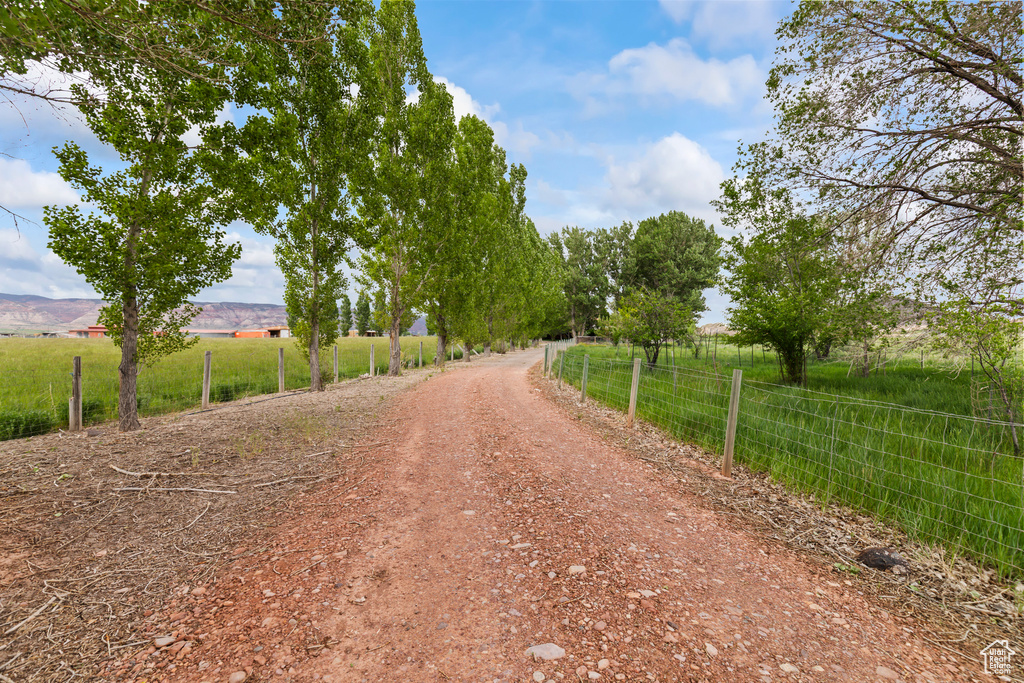 View of dirt / gravel road with a view of countryside