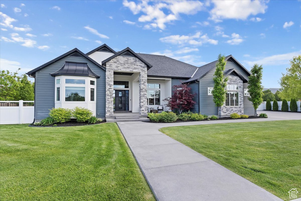 View of front facade featuring stone siding