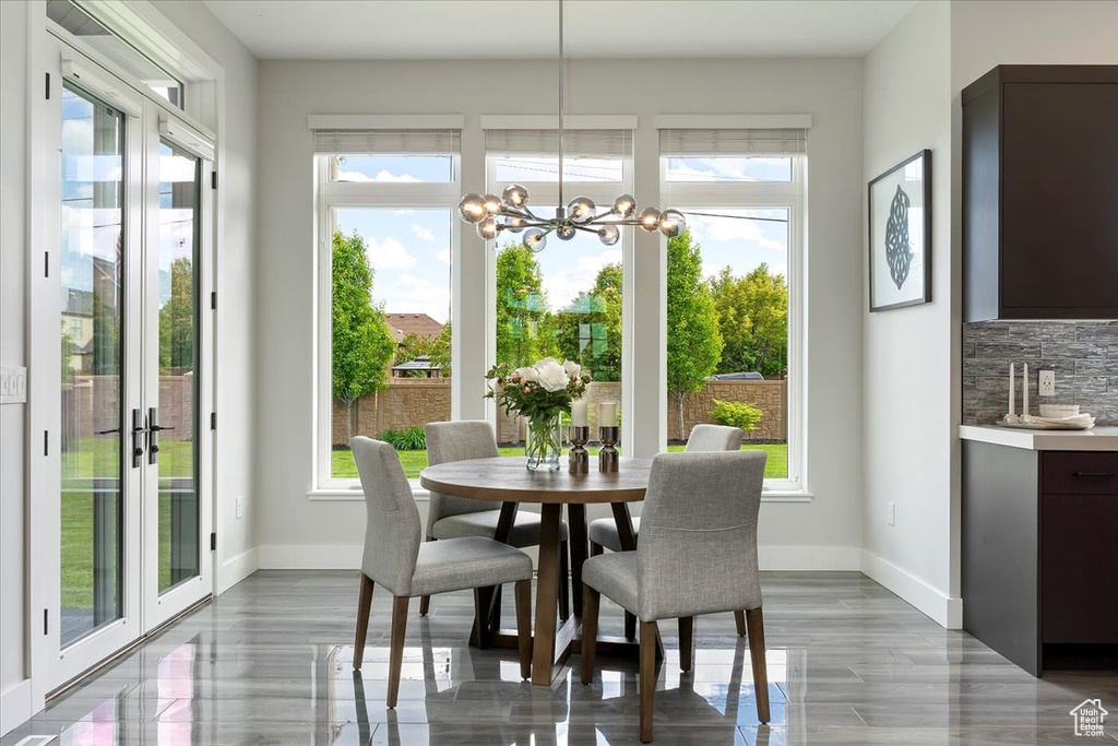 Dining space featuring plenty of natural light and baseboards