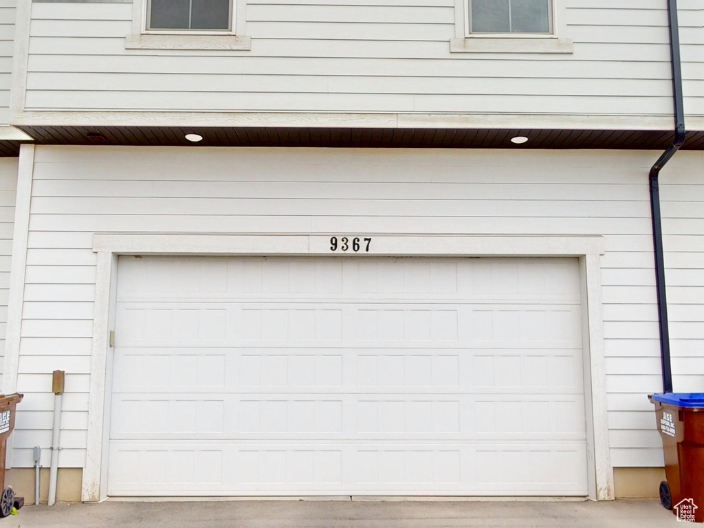 Garage featuring driveway