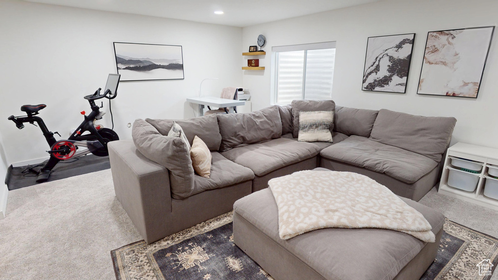 Living area featuring dark carpet and recessed lighting